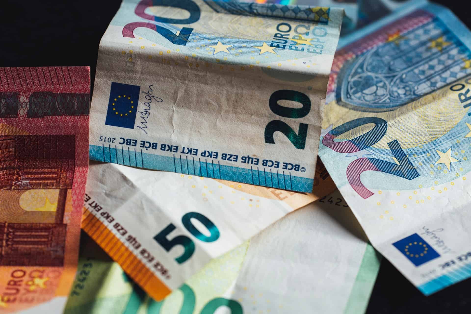 Euro bills on table