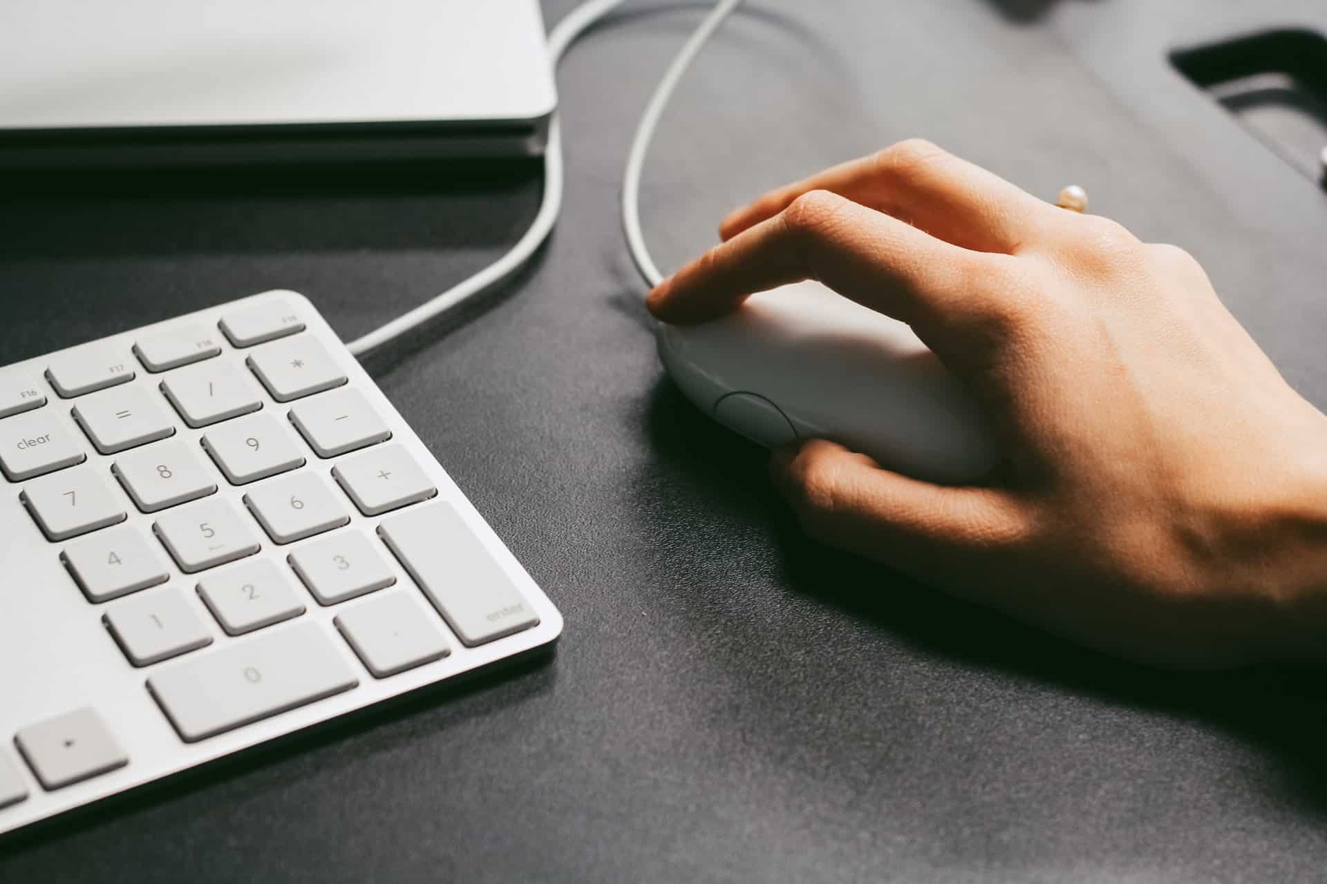 Woman using PC mouse