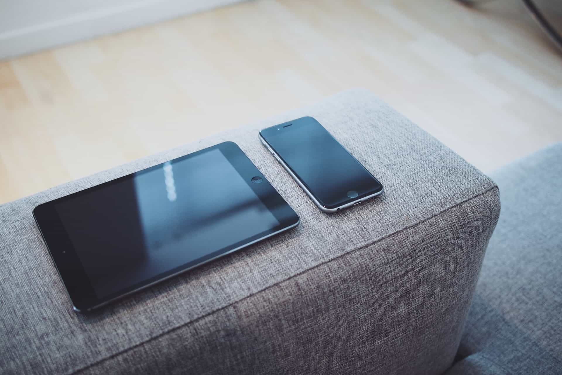 Tablet and mobile phone on sofa