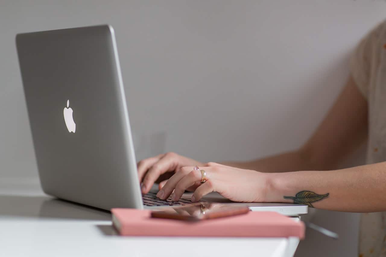 Woman typing on laptop