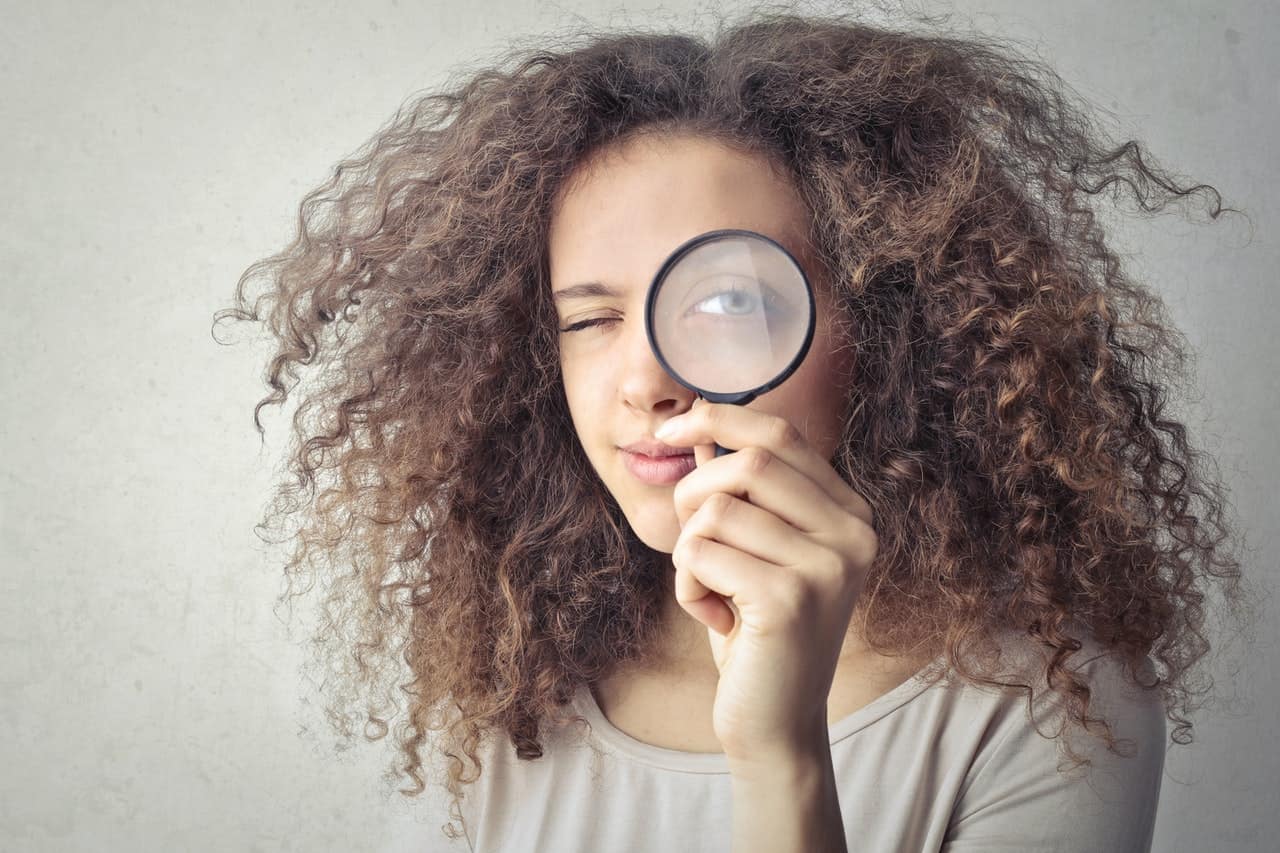 Woman with magnifying glass