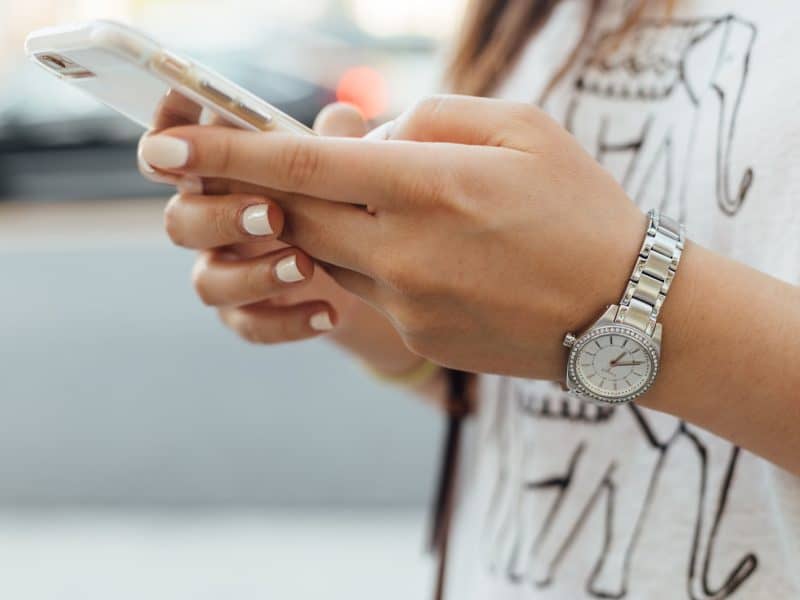 Woman holding iPhone