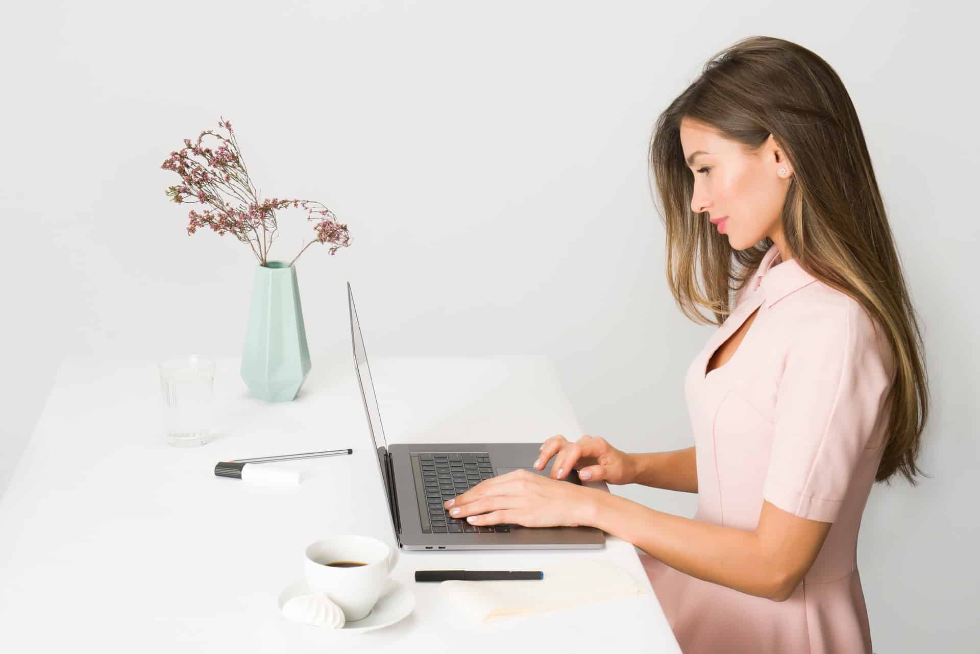 Woman sitting and using laptop
