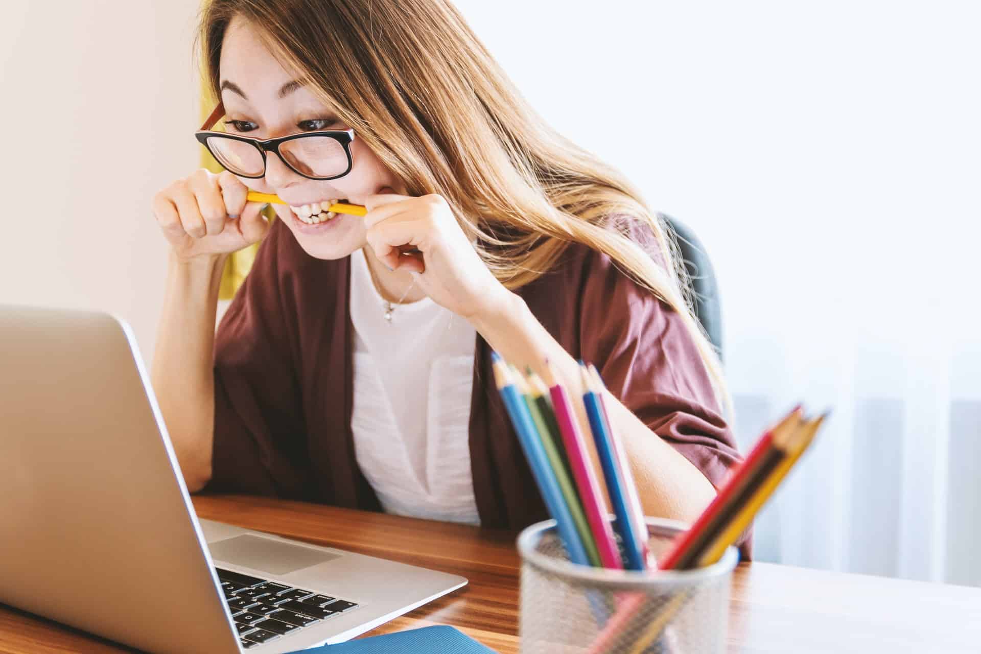 Woman sitting on chair in front of computer